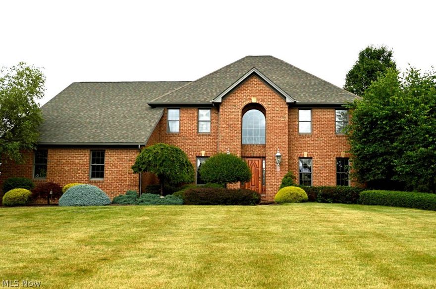Magnificent all brick two story home has been completely updated, contains a new granite gourmet kitchen, finished basement, vaulted sun room, hardwood, 1 floor study, 2 floor foyer, patio with koi pond, 2 gardens, and a stunning gazebo, sitting on almost 2 acres of land inthe canfield township!