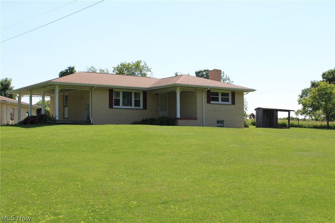 This is a great opportunity to own a ranch home with a beautiful country setting and collect royalty checks! All of the rights owned transfer. There is a 30x40 heated detached garage with 12' lean-tos and a 28x28 two car garage with a new roof. The house has three bedrooms on the main floor and one full bath. There is a sun room on the back that is 9x19 and a front porch that is 10x26. There is a small section of pasture fenced for those outdoor animals you may want. The water is from a well but public water is available. Come check out the opportunities that this property has to offer.