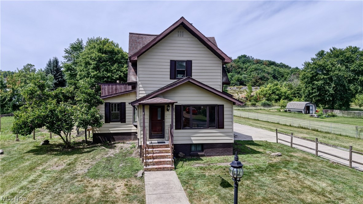 All the work has been completely done in this renovated 3 bedroom 2 bath. An opportunity you don't want to miss. The house including the shutters have been freshly painted, on the back open frame porch there is new metal skirting and new stairs. Inside from the front porch is a sun room, with fresh paint and new flooring could be used as an office or playroom. The living room has new floors and fresh paint, with a bay window. The kitchen has new flooring and freshly painted cabinets, formica countertops and subway tile backsplash. A previous 1/2 bath is now a new full bath, complete with new tile floor, vanity, light fixtures and tub surround with tile. There is a pantry one the 1st floor with new flooring, in the pantry are 2 separate closets. The steps to the upstairs have been carpeted and you will find 2 nice size bedrooms with fresh paint and new carpet. Also a 2nd bathroom is on the second level. The main level has a 432 sq. ft. open frame porch. A detached/garage/workshop is 2127 sq. ft. with 3 garage doors, paint booth, air compressor, radiant heat, air hoses and an attic that could be finsihed.