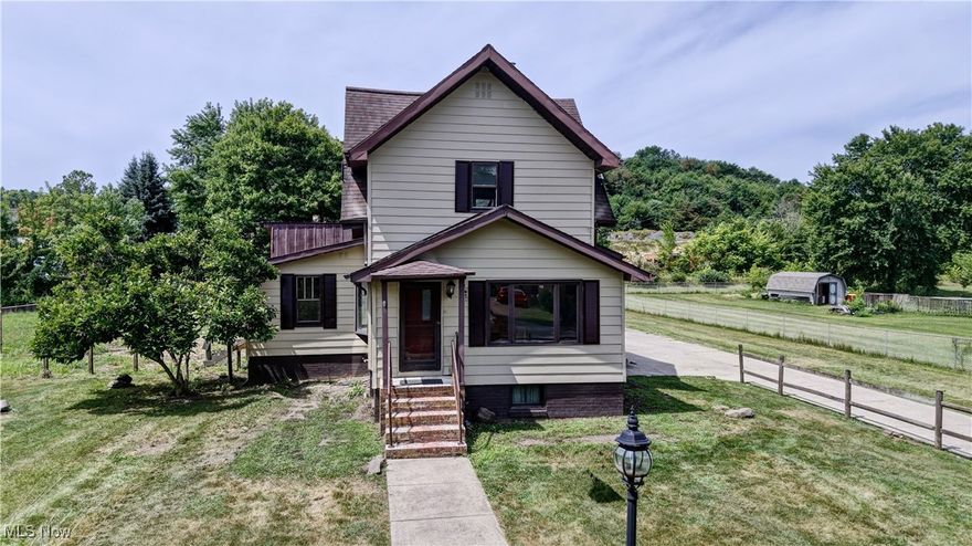 All the work has been completely done in this renovated 3 bedroom 2 bath.  An opportunity you don't want to miss.  The house including the shutters have been freshly painted, on the back open frame porch there is new metal skirting and new stairs.  Inside from the front porch is a sun room, with fresh paint and new flooring could be used as an office or playroom.  The living room has new floors and fresh paint, with a bay window.  The kitchen has new flooring and freshly painted cabinets, formica countertops and subway tile backsplash.  A previous 1/2 bath is now a new full bath, complete with new tile floor, vanity, light fixtures and tub surround with tile.  There is a pantry one the 1st floor with new flooring, in the pantry are 2 separate closets.  The steps to the upstairs have been carpeted and you will find 2 nice size bedrooms with fresh paint and new carpet.  Also a 2nd bathroom is on the second level.  The main level has a 432 sq. ft. open frame porch.  A detached/garage/workshop is 2127 sq. ft. with 3 garage doors, paint booth, air compressor, radiant heat, air hoses and an attic that could be finsihed.