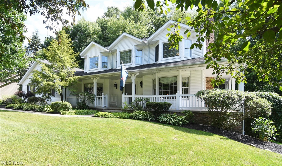 Quality built by Yoder Builders! This home features a huge double lot/side yard with a wrap-around porch to admire the peaceful setting of the woods from the side and back. Enter the 2-story hardwood foyer and enjoy the many spacious living spaces - formal living room with wood burning fireplace with french doors opening to your 19 x 10 screened-in porch to enjoy the seasons. There's a door leading you to the nice deck as well. The dining room will seat many guests. Beautiful Schrock kitchen with updated granite, backsplash, pull out pantry and stainless steel refrigerator and dishwasher. There's even a pass through to the dinette area with sliders to the beautiful deck and screened in porch. The first floor master features large walk in closet and full bath, laundry (with access to the deck) and powder room,which complete the first floor. The 2nd floor offers 2 huge bedrooms w/bay windows and spacious full bath w/dbl vanity, granite and skylight (master could be on the 2nd floo