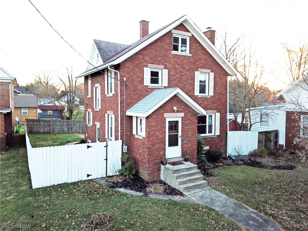 Check out this charming brick home! This home boasts 4 bedrooms with a possible 5th! Located close to shopping and schools. Beautiful woodwork and hardwood flooring throughout! Finished attic is possible 4th bedroom and 1st floor Den possible 5th bedroom. Living room has a fireplace and built in storage. Finished recreation room in lower level. Relax on the rear porch and enjoy the fenced in yard with a storage barn. Updates include: new hot water heater, main water line replaced (2013), kitchen counters & sink (2012), main bath updated (2014), new roof and front door (2012), new windows (2009), rec room tiled (2007), Radon mitigation installed (2008)! Nothing left to do but move in! Don't wait! Call today to schedule your showing!