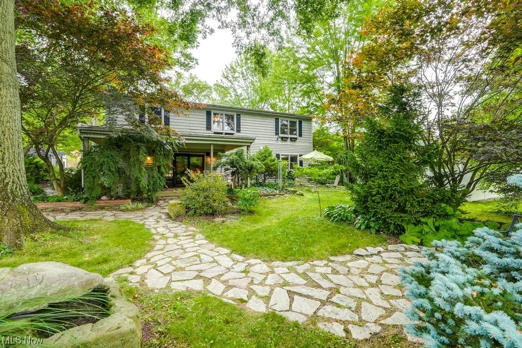 Welcome Home! This beautiful cottage-style oasis is awaiting its new owner! As you pull into the driveway, you'll notice the beautiful landscape and trees that greet you, heading to the front door. Upon entering inside, you'll find a spacious formal dining area and an eat-in kitchen. Upstairs holds three large bedrooms, a full bathroom, a loft with bright skylights (great for an office or coffee room!), and an additional finished storage section. As you head back down to the first level, just a few steps down you'll find the living room. Plenty of space for all your entertaining needs! There is also another full bathroom, as well as a laundry room just around the corner. This area walks right out onto the covered patio/backyard. Just like the front yard, you'll see the meticulous care for all of the trees and landscape; such a peaceful setting. A well provides free water for all your yard-watering needs throughout the seasons! Schedule your private showing today! Well and pump tank rep
