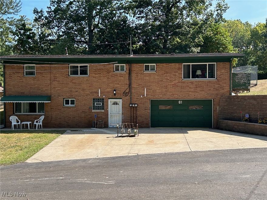 Location!  Location!  Location!  Super portfolio addition in a quiet residential neighborhood this triplex with ALL BRICK EXTERIOR offers a 2 car garage (22x24) with a large concrete drive for ample off-road tenant parking.  Five exterior doors is a great safety features.  Vinyl windows with pleasant views, updated leaf guards, and one layer roof.  Tall 12-course basement, steel beam in garage, fenced backyard.  Three separate electrical boxes, 3 gas meters, 3 furnaces, 2 central air units, 1 owned water softener, 3 oven-stoves, 2 refrigerators, 2 dishwashers, 2 microwaves, and double sinks in all kitchens.  One 2 bedroom, two 1 bedroom apartments all share large laundry area.  Three glass block windows in wise areas. Built in 1958 appears to be sturdy solid construction.  Gas heat, city sewer and well water.  Popular dead end location. New flooring and paint will go along way with long-term tenant possibilities.  Pick your own tenants, no lease commitments. Selling AS IS