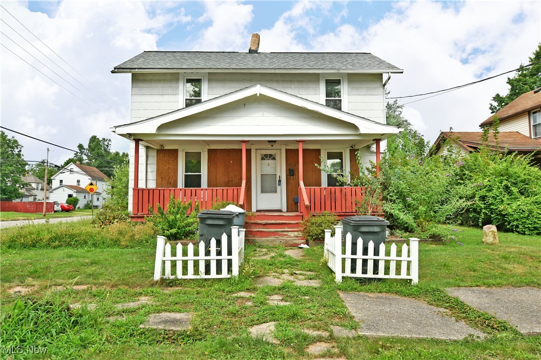 Looking for a fresh investment property or an easy start with plenty of potential? This two story Niles home is the perfect canvas to your creativity! Situated on a prominent corner lot, features include a oversized, two-car garage and an accompanying storage shed. Multiple covered patio spaces add to the curb appeal and ease of outdoor relaxation, leading both to the formal and side entrances for daily use. Through the front door, a carpeted parlor and dining room includes an open coat closet as it wraps around a brick pillar to find the accompanying living room. Here, wood paneling is awash in natural light from the oversized windows. The robust kitchen brings tiled flooring and plenty of open space for dining or an island. Upstairs, a colorfully painted guest bedroom branches away from the landing. Further down the hall, a full bath splits off into a second bedroom while offering its updated vanity and shower surround. A walk-in closet adds to the appeal. The larger master bedroom completes the floor with its ample corner closet. Storage and utilities are found at the basement level.