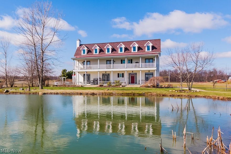 Welcome home to this beautiful Southern Plantation Style home on 10 beautiful acres! Full front porch and 2nd floor balcony over look fully stocked Pond!Elegant foyer with 10 foot ceilings and beautiful crown molding will impress any buyer! Amish wood flooring in the foyer, Living room, dining room, 1/2 Bath, and staircases. Large living room offers a wood burning & propane fireplace. Large eat-in kitchen with huge island, heated ceramic heated floors, local amish made maple cabinets, stove with griddle (propane & electric hookup), all appliances in kitchen stay including wine cooler & trash compactor. Enjoy your 16x27 sunroom that is located right off the kitchen. On the 2nd floor you have a huge Master Bedroom that has its own fireplace and also has a private bath with a whirlpool tub and separate shower. Three more large bedrooms and laundry room on the second floor. On the third floor you will find two more large bedrooms and Amish built in shelving.  Finished basement with rec roo