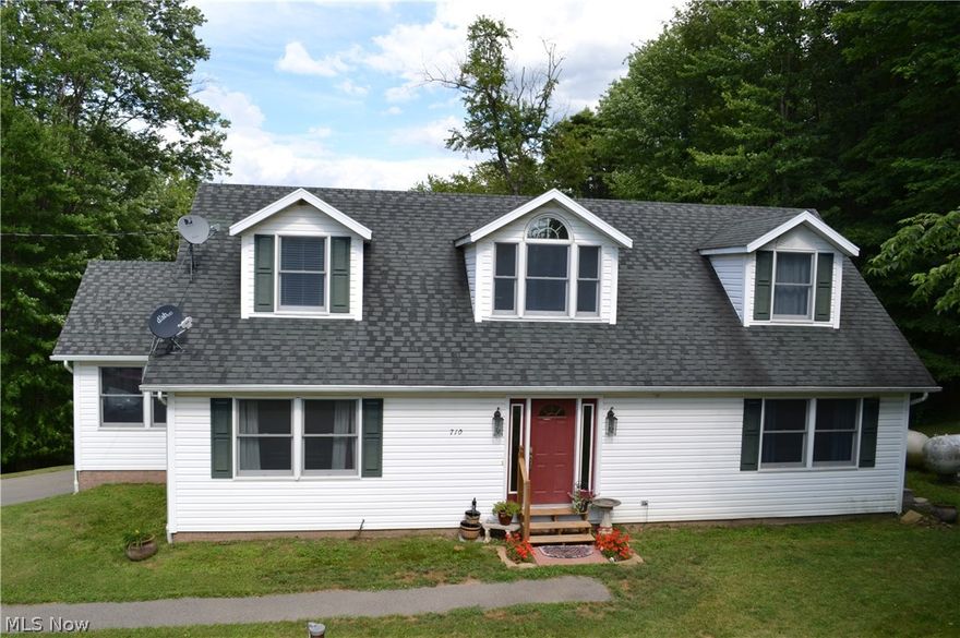 COUNTRY ROADS...TAKE YOU HOME!  Spacious and inviting 3 BR, 2 full and 2-1/2 baths home situated on 1.5 acres.  Beautiful decor welcomes you into this property that includes a Master BR with walk-in closets and bath with separate shower and garden tub.  1st floor laundry, bright and impressive fully equipped kitchen, formal DR and finished recreation room with an added bonus room.  Come outside to a huge 24x32 deck overlooking the grounds and an above ground pool perfect for family and entertaining!