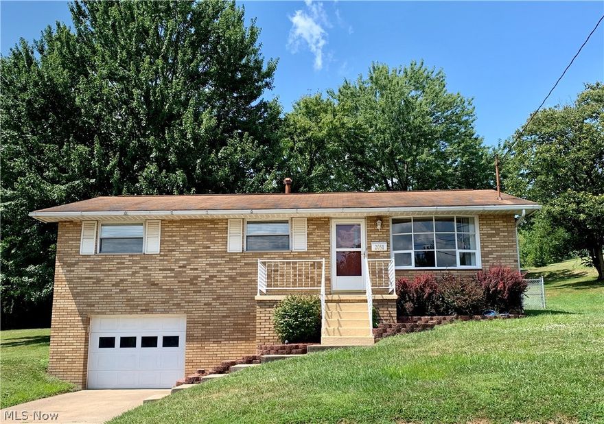 Large double lot!!! This Brick split entry home is move in ready - freshly painted with an updated eat in kitchen and newer flooring! This home offers a living room with bay window, three bedrooms and 1.5 baths. The bathrooms have been updated & the full bath features heated floors!  You will appreciate this homes location which is close to schools and shopping!  A large back deck overlooks an oversized fenced backyard with extra lot for recreation!  The lower level offers additional storage space and a single car garage!  Get ready to move in! Call today for a private showing of this great home!