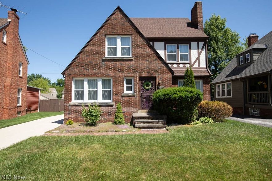 Move right into this impeccably-maintained colonial with almost 3000 sq ft of total living area, including the finished 3rd floor and basement with rec room and bath! 4 bedrooms, 2.5 baths, beautifully-updated and violation-free! Amazing kitchen was remodeled in '23 with cabinets, countertops, flooring, and stainless steel appliances. Hardwood floors flow throughout most of the home, including the spacious living room with wood burning fireplace, sunroom, and formal dining room (with built-in cabinets). Upstairs are 3 bedrooms and an updated full bath on the 2nd floor, plus the finished 3rd floor is 2 rooms, making it a great teen or primary suite. Updates: new roof in '23; concrete driveway in '20; 3x 240v electric car outlets in the garage (also great for welding/plasma cutting); smart thermostat; newer windows. Other features: enclosed rear sunroom which opens to an expansive deck and private back yard; patio AND balcony; air filtration system; humidifier; basement laundry which includes the washer and dryer; 1st floor powder room. MANY contents negotiable! Convenient location, just minutes to the Cleveland Clinic, University Circle, and Downtown Cleveland, close to restaurants, shopping, schools, and more!