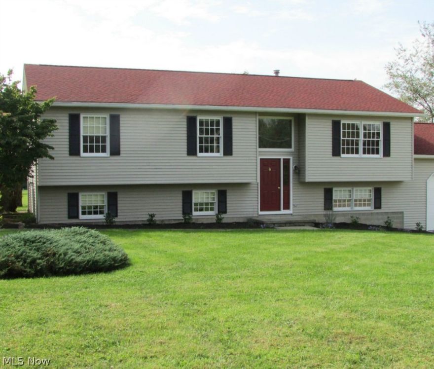 There's No Place Like Home! Come find a place of peace and quiet. This 4 bedroom, 2 bath home with a 2 car garage on one acre in Green, next to Robin's Trace, makes a good impression. Green local schools. The inviting entry leads to the main floor which features a welcoming living room and dining room with access to the large deck that are just off the spacious eat-in kitchen. Three nice sized bedrooms with ample closet space and a full bath adorned by double sinks completes the main floor. The walkout basement features a large office/library with built-ins to help you get and stay organized. A warm family room, fourth bedroom and a full bath are all features of this great home. This beautiful lot with space to run, play or even garden can be enjoyed from the large deck. Location of home is minutes from shopping, dining, highway and Portage Lakes State Park. This home has been freshly painted and new flooring has been installed. Roof replaced July 2014.
