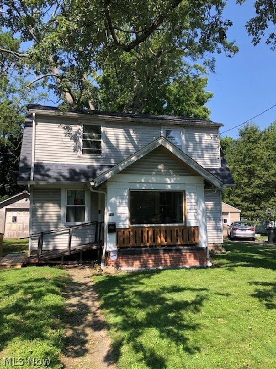 Don't miss this classic Goodyear Heights Colonial loaded with potential. The front porch overlooks the double lot. Living room that opens into the kitchen with eating area. Half bath and laundry room on the first floor. Back hallway with french door that leads to the nice size deck and treed backyard. Upstairs has 2-3 bedrooms. Two of the bedrooms are tandem, or one bedroom with a sitting room. Main bathroom with pedestal sink, tub and shower. Many updates started, but just need finished to turn this house into a home. New windows on the first floor 2021, updated electric 2020, porch railing and porch windows 2021.
