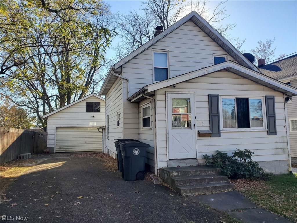 Attention Investors! Located on a dead end street, this home has so much potential AND offers a nice 2.5 car garage! Spacious living room with combination office/bonus room. Dining room, first floor bedroom and foyer entrance. Upstairs you will find 2 more bedrooms with an extra room - could be a dressing room or walk in closet and full bath. Home sold "as is".