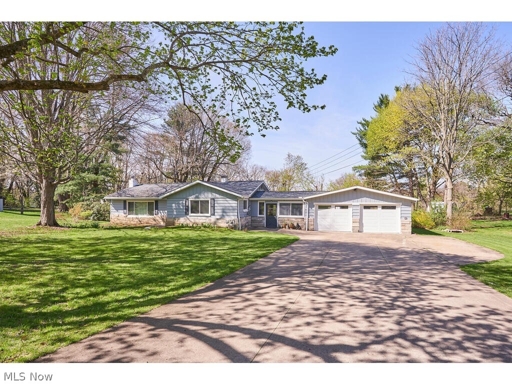 A REAL FIND! FANTASTIC, FULLY RENOVATED RANCH HOME ON LARGE LOT! This large home with open floor plan, 3 Bedrooms and 2 FULL BATHS sits on a beautiful wooded lot, of almost a half acre, with mature landscaping, just down the road from nearby Springfield High School. Knotty pine paneling radiates warmth, giving the home the feeling of a cozy retreat. House has an open floor plan from the Kitchen through the Dining area and large Great Room with gas fireplace and bamboo flooring. Updated Kitchen has a custom, copper penny floor and new appliances. All 3 Bedrooms have spacious closets and the Master Bedroom has TWO closets with custom closet organizers. Main floor bathroom has new tile, fixtures, custom lighting, and cork flooring. Attached, two car garage is connected to the house by a spacious (22x14 ft.) heated breezeway. Large backyard is private. Driveway includes extra large parking area with an exterior 30 amp RV electrical hook up. NEWER well pump, expansion tank, water softener,