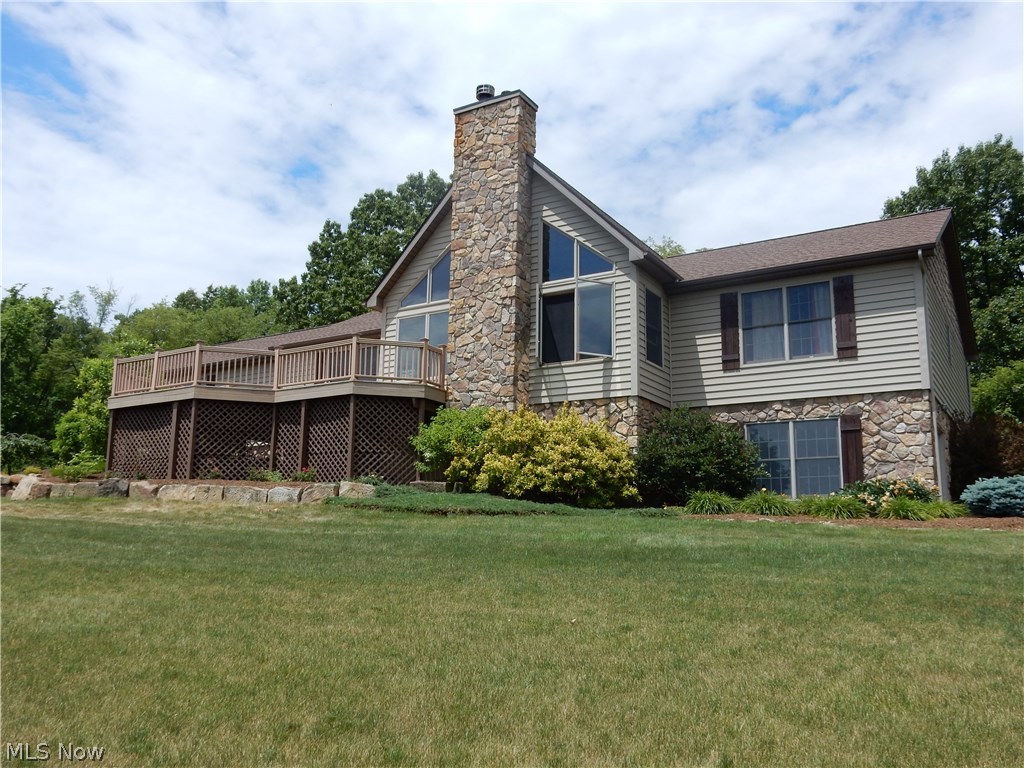 Spectacular, one of a kind home built in 2007, located on 5 private acres. So close to paradise, you can almost see it out of the huge picture windows that frame the beautiful stone fireplace. Off the living room is access to a composite deck where anybody would love to enjoy a drink and take in the beauty of the scenery. You will love the WIDE open living space the moment you walk in the door. The kitchen offers an abundance of spacious quality made cupboards , two tone granite counters and stainless steel appliances. Through the sliding door to the back yard, enjoy the stamped concrete patio to entertain family and friends. From the master bedroom, you will enjoy the breathtaking views on a daily basis. The master bath offers a wonderful soaker tub, free standing shower and double walk-in closets plus a large vanity. Two guest bedrooms match in size and closet space. Just down the hall you will find the large laundry room and half bath which leads to the large 2.5 stall attached gara