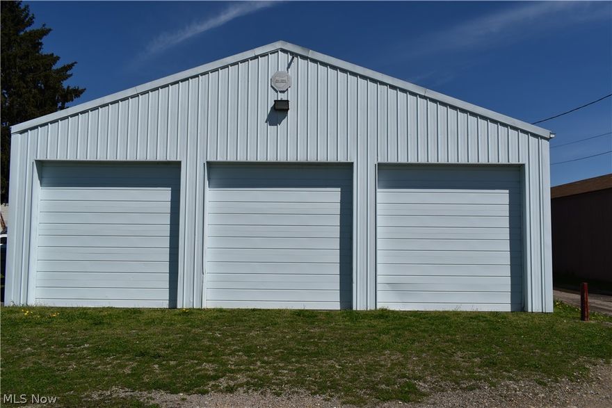 This site would be great for a auto mechanic shop or maintenance shop.  The building has new built-in cabinets and 3 11 foot high garage doors.  New lights have been installed throughout the building and property includes security system.  There is plenty of parking with the inclusion of the extra parcel lot.  Don't miss this opportunity to own this great condition building.  Call today for a private showing of this property.