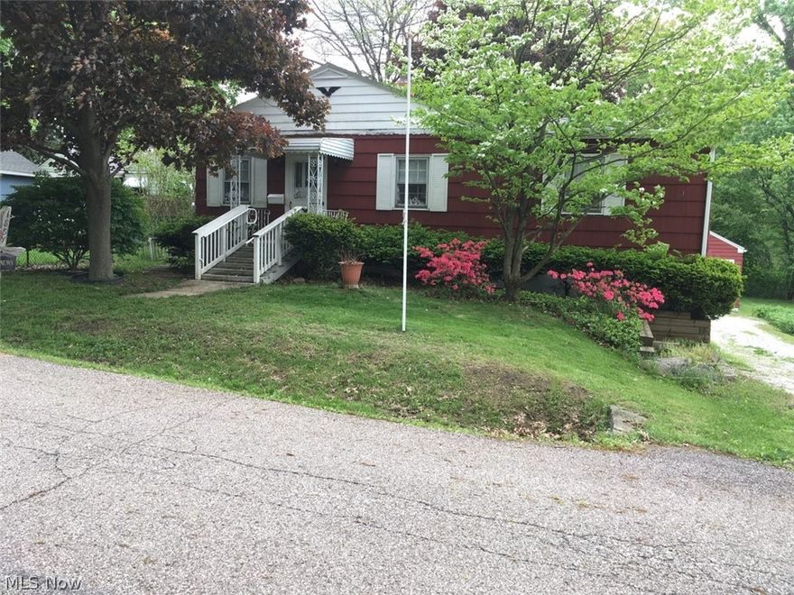 Lots of potential! 3 nice size bedrooms. 2 have new carpet. Finished rec room in walk - out lower level with access to screened porch. Another large unfinished area as well as large workshop in the utility area. Detached 2 car garage. Roof 2013. Home warranty!