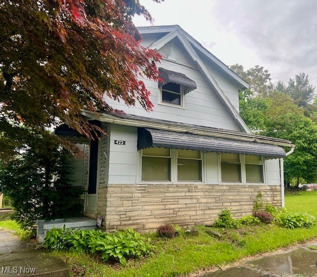 Discover this charming hidden gem tucked away on a peaceful street just minutes from downtown Youngstown. Enjoy relaxing on the lovely enclosed front porch. Inside, you'll find spacious bedrooms and updated windows throughout. The kitchen offers potential for customization, and while the owner has not lived in the home, it simply needs a little TLC to truly shine. A fantastic opportunity for homebuyers or investors ;being SOLD AS-IS.