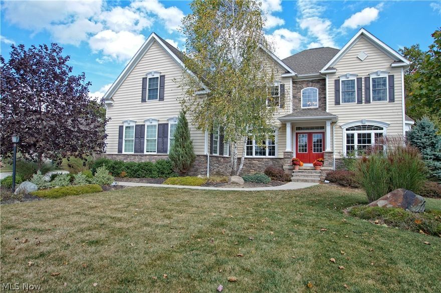 STUNNING custom built home located in Sharon Township in the desirable Estates At Woodfield community, featuring a beautifully landscaped 2.75 acre wooded property. This spacious 4 bedroom, 4.5 bath, with a 3 car side entry garage home includes over 6,600 living sq ft with completely finished walkout rec room with a wet bar and a work out room that can be used as a multi-purpose area. A gourmet eat-in kitchen has a massive center island with granite counter-tops, double ovens, and a sun room with lots of natural light. The two-story great room has a floor-to-ceiling stone fireplace and lots of built-ins. The first floor den/library is great for an office or extra living space. All three levels feature 9ft high ceilings and lots of closet space. Laundry/mud room with built-in coat/shoe organizer is located on the first floor. The master suite includes a tray ceiling, sitting area, two walk-in closets with a newer closet system, spacious master bathroom with double sinks, soaking tub, an