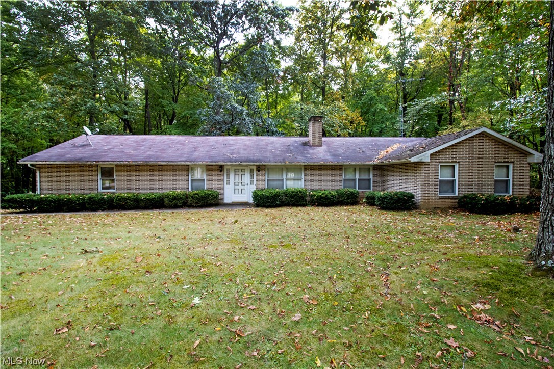 Offered is a solid brick ranch with three bedrooms, 2 full baths, partial basement, fireplace, two car garage and a bonus area with a separate entrance that has many possibilities. Newer septic system! All situated on a one-acre wooded parcel in Northwestern School District.
