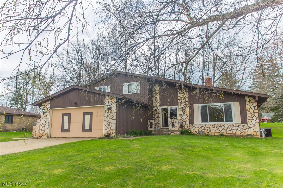 Welcome to the Highly Desirable Strathmore Community! Located in Valley View this home has a lot to offer. Enter through the double front doors into the large living area with vaulted ceilings. The updated kitchen which has freshly painted walls with an island and a bar top that has its sights set into the family room with a fireplace! A private first floor bedroom sits off the family room that also has first floor laundry! Off the family through your sliding doors a multi-tiered deck awaits your summer fun. Upstairs has three bedrooms and two full bathrooms! Also located close to Valley View Woods Park. The basement has been freshly painted and new carpet. This home is waiting for its new owners!