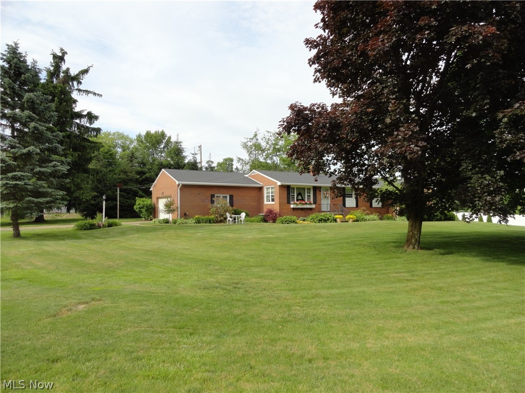 Big, beautiful, brick ranch on a quiet country circle is packed with updates. Three spacious bedrooms, a large family room and very private patio make this stand out from the rest of homes in Lake Local. As you enter the living room you will notice the beautiful hardwood flooring. The Dining area is in the heart of the living area, next to the updated kitchen and offers view of the fireplace in the Family Room. The Kitchen boasts granite counters, laminate flooring and a full compliment of stainless appliances. Off the large family room you will find the absolutely beautiful, private brick patio. Down the hall from the living room, is an nicely updated main bath, and three large bedrooms. Master bedroom has its own updated full bath and a walk-in closet where there is a stackable washer and dryer. The oversized 2 car garage is also off the Family Room. Inside the garage is the entrance to the basement where you will find storage space, a large workshop area, Laundry hookups if you c