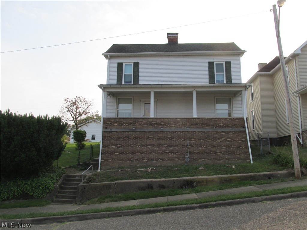 This is truly a very unique Shadyside property! This home is situated on a double lot that includes 2 24’x24 detached garages. The first building is split and includes a separate furnace to heat your garage get-away or workshop, and the garage portion features a commercial height garage door. The second garage is newer and both buildings have a separate utility meter from the house. The upper garage holds the workshop with room for one car, while the lower has room for two vehicles. What else makes this property different other than 2 full size garages? How about an approximate 8’x10’ fully underground 1960’s era fallout shelter with 8” poured concrete walls? The shelter has been vacant for some time and currently has standing run-off water. Use your imagination for the endless possibilities of this shelter’s use. There are no utilities to the shelter as it is fully “off the grid”.
The inside of this home features plenty of storage/closet nooks and spaces throughout. The