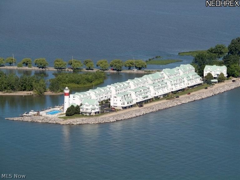 Come and enjoy the very best Lake Erie living has to offer at Point Retreat. Located on the eastern tip of the Cedar Point Peninsula, this lakefront 3BR condo is an ideal setting for year round living or the perfect seasonal/vacation home. Nowhere else will you find views of Lake Erie, Sandusky Bay and Sheldon's Marsh which rival these views. Whether your preference be picturesque sunsets from the boardwalk, watching eagles soar overhead or kayaking, Point Retreat has it all. Dockage is available to enjoy boating or jet skiing. This beautiful unit features 3 floors of luxury living and includes an attached ground level garage. On the main level, you will find an inviting open concept kitchen and Great room, ideal for gathering/entertaining. From the Great room, you will enjoy an amazing view of Sheldon's Marsh. The 2nd floor features 2 guest bedrooms w/full bath & laundry. The 3rd floor Master Suite includes a full bath and is accentuated by a lake and bay views.