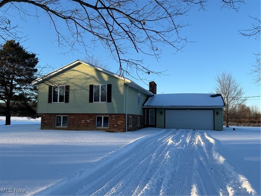 This is a bargain in Rootstown.  Just reduced for a quick sale.  Land is valued at $174,625.00 alone for the 11.3 acres.  Where else could you buy a house and pole barn for $194,375.00?????  
 Welcome to 6747 Giddings Road in Rootstown! Nestled on 11.3 acres, this property offers the perfect balance of comfort, functionality, and endless possibilities. The well constructed home features 3 spacious bedrooms and 2 full bathrooms, providing a warm and inviting space for everyday living. The open kitchen flows easily into the dining and living areas and there are plenty of windows allowing full light and views of the expansive property.  The living room and recreation room have wood burning fireplaces.
A two-car attached garage adds convenience, while the impressive 30 x 50 pole barn expands the property’s potential. Whether you envision a workshop, storage for equipment and vehicles, or space for hobbies and projects, the pole barn is ready to accommodate your needs.
Outdoors, the 11.3 acres offer incredible opportunities—whether it’s creating trails, gardening, farming, keeping animals, or simply enjoying the privacy and natural surroundings. With ample space and flexibility, this property is perfect for anyone seeking country living with room to grow. 
Recent updates include NEW ROOFS on home and pole barn in 2024, new gutters, new soffits, all new doors in entire home and new wrought iron railings on inside steps.  Older updates include hall bathroom, LVT flooring on upper level, boiler recently serviced, new chimney completely rebuilt, newer electrical, newer water heater and updated sump pumps.  Also added were "Leaf Guard protectors" on gutters with lifetime warranty.
This home could be brought back to full potential with some updating so don’t miss your chance to make this unique property your own—schedule a private tour today!