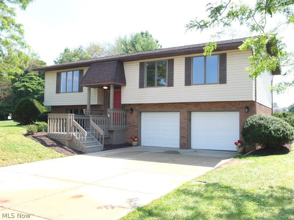 WOW! Great location, fantastic neighborhood and setting and immaculate condition! This almost 1,800 square foot, 3 bedroom, 2.5 bath home in Green has everything you have been looking for! Remodeled kitchen with new countertops, new hardware, tile backsplash, new flooring, new sink and new faucet. Kitchen has a breakfast bar and dinette area. Nice 3 season room that opens up to big private backyard. Home sits on a cul de sac! Master has a walk in closet and private remodeled full bath. Nice size living room and lower level family room with fireplace. Half bath in lower level and main bath have been remodeled too! 2 car attached garage, new flooring and fresh paint throughout, Anderson Windows and new hot water tank. Nothing left to do but move in and start enjoying. A fantastic find in Green Schools! You won’t be disappointed!