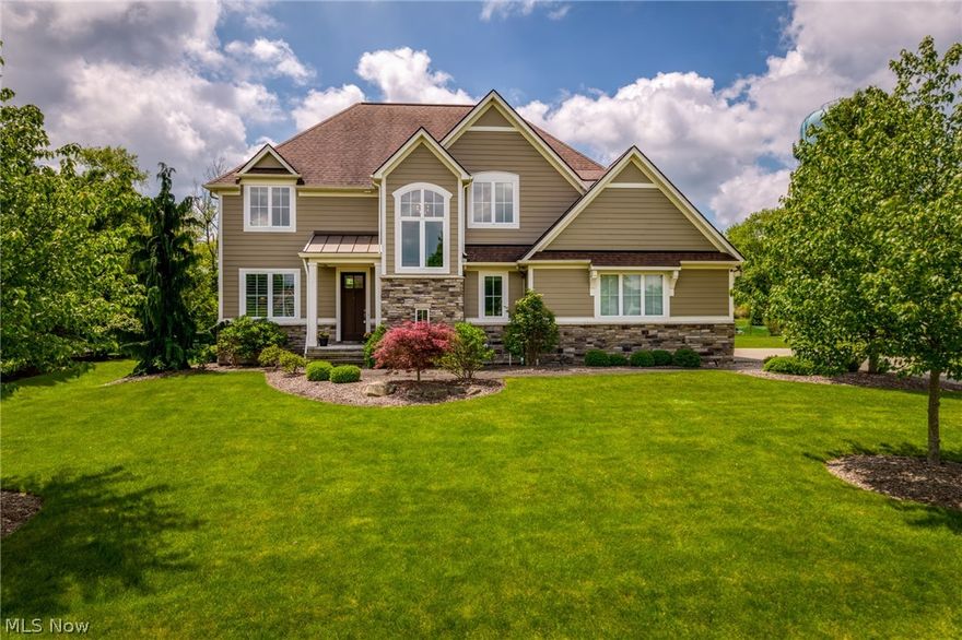This custom Payne & Payne home showcases 10-foot ceilings, custom 8-foot solid doors, 2x6 construction, enhanced insulation, and rich maple hardwood flooring accented by elegant 7-inch baseboards. Extensive recent improvements elevate the home even further, including a stunning 2021 custom kitchen addition, new bedroom and full bath additions, and a beautifully designed walk-in closet by California Closets with a lifetime warranty. The chef’s kitchen is a true centerpiece, featuring double islands, granite countertops, subway tile backsplash, abundant KraftMaid cabinetry, and premium stainless-steel appliances, all opening to an expansive dining area ideal for entertaining. The inviting living room is filled with natural light from a wall of windows and anchored by a dramatic floor-to-ceiling stone fireplace. Additional main-level highlights include a private office or study, mudroom with custom Amish-built cubbies, powder room, and a spacious laundry room with ample storage. Interior updates such as crown molding, fresh paint, LED lighting, ceiling fans, new carpeting, and Hunter Douglas Silhouette blinds add a polished, modern touch throughout. Upstairs, the luxurious owner’s suite offers two custom walk-in closets and a spa-like bath with double vanities, granite surfaces, and an oversized shower. The finished lower level expands the living space with a large recreation room, full kitchen, bedroom or bonus room, and a fourth full bath. Three-car attached garage includes an EV charger. Additional features include LVT flooring, new carpeting, upgraded lighting throughout, and a Kinetico water system. Home Warranty available. This  meticulously maintained property truly checks every box. Experience refined living & the sought-after Barrington lifestyle today. Full improvements list in supplements.