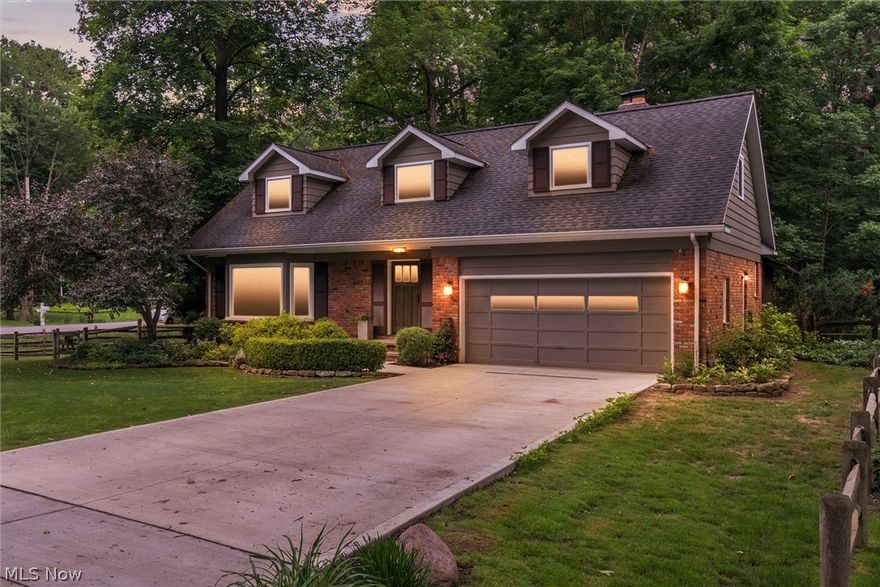 Beauty surrounds this picturesque brick Cape Cod nestled in a quiet secluded neighborhood. This distinctive half acre property, includes a spacious front lawn and a wooded back lot with a creek running through it. A charming screened in porch as well as updated Pella windows throughout the home capture the beauty of the surrounding landscape. Stepping inside this home, you are greeted by an open foyer leading to a handcrafted designer kitchen made with local cherry and walnut hardwoods. This perfect chef’s kitchen includes a six burner gas stove, double ovens, and custom pullout spice racks. The first floor also includes a spacious living room and dining room, both of which are ideal for entertaining. The upstairs features four bedrooms including a generous master with a newly renovated ensuite and recently refinished hardwood floors. The updated basement provides a canvas that is left to your imagination. This exceptional home is within walking distance to local parks and shops. Come