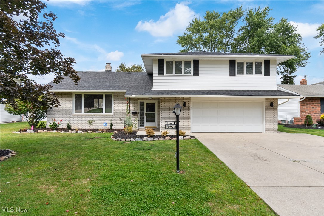 Welcome to this move-in ready 4-level split in the desirable Indian Creek Estates of Middleburg Heights! As you step inside, the foyer opens into a spacious living room with vaulted ceilings, wood beams, and a large picture window that fills the space with natural light. The kitchen showcases beautiful Amish-built walnut cabinets, with all appliances included. The inviting family room offers new LVP flooring, a cozy fireplace, and even a hidden door leading to the laundry room and updated half bath. From the family room, sliding glass doors open to a large, fully fenced backyard with a cement patio and storage shed. Upstairs, the primary suite boasts a fully renovated bathroom complete with a walk-in shower with glass doors, new vanity, flooring, and fixtures. Three additional generously sized bedrooms feature fresh paint and new carpet, with one offering direct access to a spacious walk-in attic. The main hall bath completes the upstairs. This solidly built home also has original hardwood floors beneath most carpeted areas (excluding the family room). The basement expands your living options with a finished rec room, workshop space, and bonus storage room. Conveniently located near the Cleveland Metroparks and Big Creek Parkway, this home blends charm, updates, and functionality. This home is ready for its next owner to enjoy! Other updates include: All New Carpeting (2024/2025), New paint throughout (2024), Furnace (2022), HWT (2016), New Roof (2025), New lights, outlets, door knobs/hinges, all vents (2024), New Garage Door and Opener (2024), Fresh landscaping (2025), New Stove and Microwave (2025), Fully Renovated Primary Bath (2025). Schedule your private tour today!