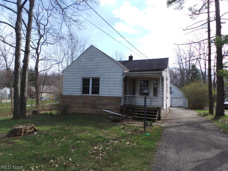 Cozy bungalow in need of a bit of TLC.  Lovely deep wooded lot, partially fenced.  Don't miss a great opportunity to own!  Property sold AS IS.