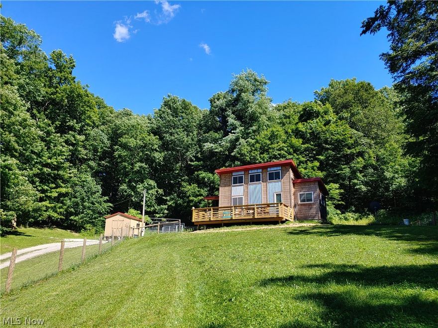 Come and view this unique tiny home with an abundance of storage and built by the Amish. This home is nestled on a hillside amidst the woods. This property is a small commute from downtown Columbus. Just a mile-and-a-half south of Route 70 off 668. Slightly over four acres of land. Home is about 550 square feet.  Large elevated deck and 2 nice storage sheds. Electric 200 amp with electric to one shed. Well water with no smell or taste. Septic with leach field. Large fenced-in yard. Sit on the deck and enjoy the birds and wildlife just outside your new home.