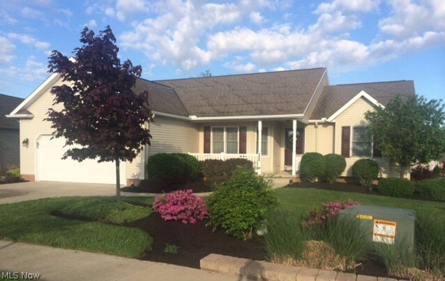 Move right into this 3 bedroom, 3 bath home located in a newer north end neighborhood. Just off the entry you will find a custom kitchen with large island, plenty of storage, and sunny dining area.  The pass through opens into a spacious living room featuring a brick gas fireplace and access the deck. The split bedroom plan offers 2 bedrooms that share a full hall bath. The master bedroom highlights include a tray ceiling, large walk-in closet, soaking tub, and separate shower. The laundry room is conveniently located on the 1st floor. The walk-out lower level is fully finished and includes a roomy family room, home office, full bath, extra storage, and a sliding door that leads to a covered patio area. Call today to see this beautiful home!