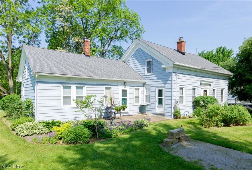 Absolutely beautiful 10.45 acre setting for this century home originally built in 1840!  You will love the charm and country living starting with a lovely open kitchen with side pantry, formal dining room big enough for large family gatherings, first floor laundry, original woodwork throughout.  Major updates include a new roof in 2014, new septic in 2016, windows and electric upgraded approximately 10 years ago.  Property is full of mature trees that have never been timbered, FREE GAS heat to the home with all mineral rights to transfer!  What are you waiting for??  This is the perfect country getaway with a detached 16x34 garage, and 16x12 extra outbuilding.  Lots of frontage and privacy, yet only minutes from West Branch State Park for boating, fishing, and swimming, and minutes to I-76! Just needs a little plaster work in some rooms and you will have a beauty!  Call Today!