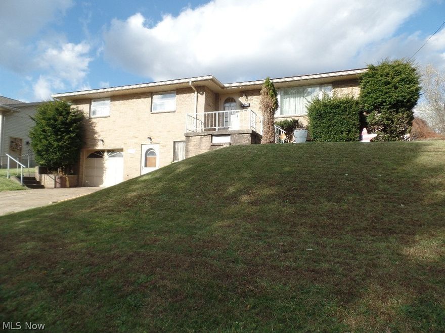 3 bedroom brick ranch with new gas furnace and air conditioner. Family room,bathroom, and additional kitchen in the basement. Detached 2 car garage in the backis equipped with a workshop, wood burner, and a half bath