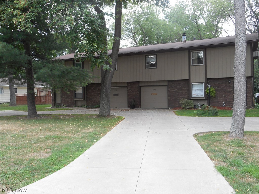 Very nice 2 unit is your perfect investment property in a great location very close to Portage Lakes! Two bedrooms, living room, family room, 1-1/2 baths, large applianced kitchen with sliders to a nice deck, laundry, covered patio and attached garage on both sides. Newer concrete driveway with extra parking on each side.