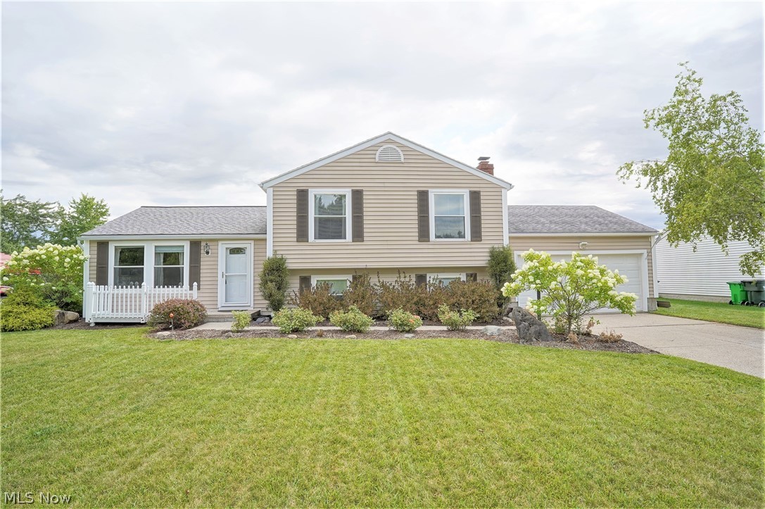 Dream a little dream right here in Stow Ohio with this spacious split level. This 2000+ sq foot home offers 3 bedrooms and 3 full bathrooms. It also features a large living room, an updated kitchen with stainless appliances, and maple cabinets. The dining room features ceramic flooring and opens to a 4 seasons room that overlooks the back deck and yard. The master suite upstairs has a balcony for morning coffee and a full private bath. The lower level offers a large family room with a brick fireplace and built-ins. There is a small office and another full bath as well. The backyard has a two-tiered deck across the back of the house that is great for entertaining. Don't Forget about the fully fenced-in backyard and the shed. Set up your private showing today!