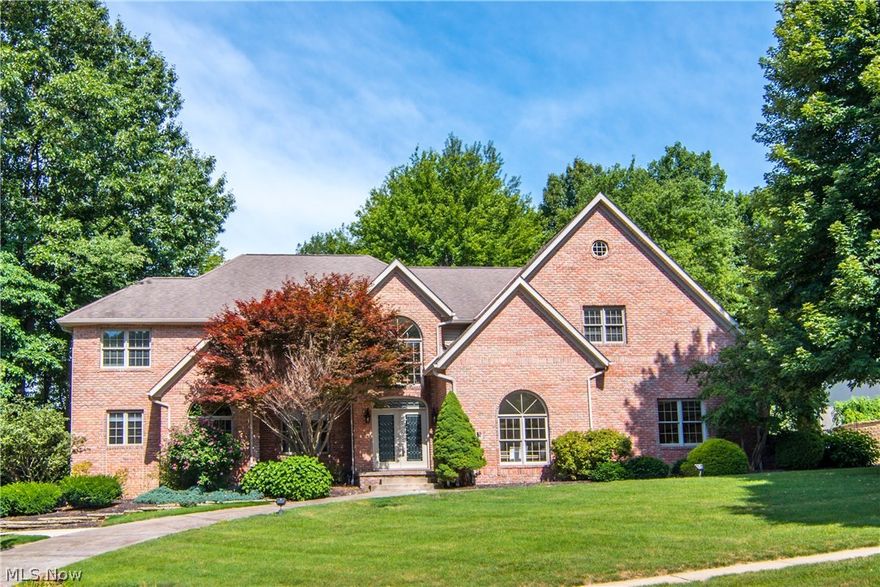 Custom built Pambi Farm Estates brick Colonial overlooks the signature 12th hole at Rose Run Golf Course & Country Club. From the foyer entry you'll be impressed with the dramatic design and unique floor plan. Soaring ceilings, open staircase, formal dining overlooks sunken living room with over sized windows across the back welcoming sunlight to fill the rooms. Gourmet, fully appliance kitchen w/ white cabinetry, granite counters & glass back splash. Huge island includes a glass cooktop & prep sink. Convenient built-in desk area. Three sided gas fireplace is positioned between the kitchen and family room. Spacious master suite w/fireplace & private balcony plus  an updated bath w/ double sinks, whirlpool tub, ceramic title floor, & skylight. Bedroom #2 has an attached, private full bath plus a walk-in closet. Bedroom #3-4 share an updated jack-and-jill bath w/ double vanity and split shower/toilet and each have a walk-in closet. 12x34 loft overlooks the living room. 11x11 mud room fea