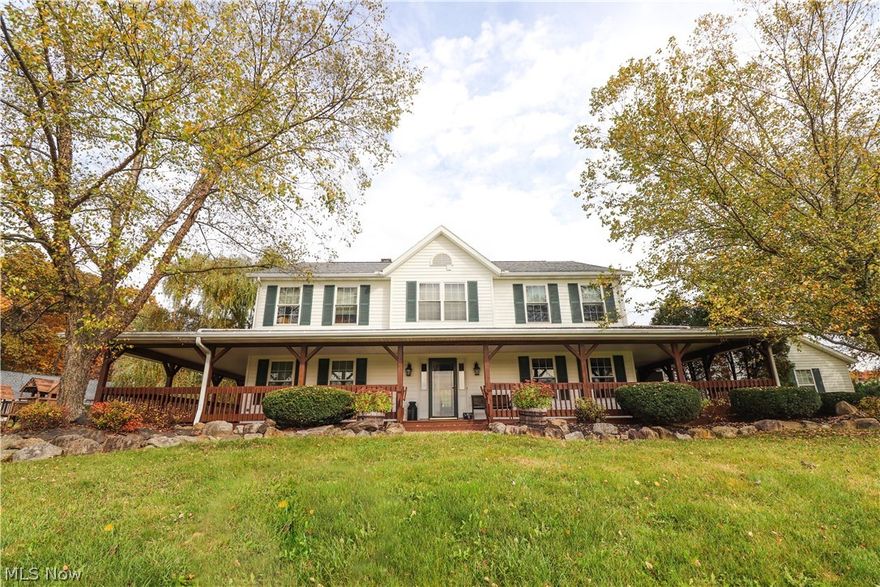 This could be your Dream Home with approximately 4,560 finished sqft, Five Bedrooms, Four Full Bathrooms, Two Half Bathrooms, Four acres of land and a 48 x 32 pole barn.  The kitchen is open to the Dining area with several large windows to enjoy the view.  The cabinets are plentiful with two lazy Susan's and pull out Amish built cupboards and a pantry.  The Great room features a Grand Stone Fireplace with a hand hewn mantle and hand pounded bronze eagle heads.  The hardwood floor in this room goes well with the second floor bannister & high ceilings. The Home has two Master Bedrooms/Bathrooms with one on the first and second floors.  The first floor Master Bathroom features more large windows, a whirlpool garden tub, His/Hers sinks, and a large tiled walk-in shower.  The second floor has three bedrooms (including a master) & two more bathrooms.  The second floor Master Bedroom has a deep walk-in closet and spacious Master Bathroom.  The Finished basement has approximately 1,496 sqft of space with built in storage cabinets.  The Pole Barn has 2 large sliding doors, two stalls, a hay loft, arena area, water, electricity, and front porch. The view is of the woods to the North of the property and gently sloping hills. The home has Geothermal heat/cooling, 2x6 inch framed walls, a wrap-around porch, new screens on the windows, and much more.  The 30x30 two car attached garage has electric, heat, water, and two garage door openers. The driveway has been neatly finished with concrete. Seller updates include energy efficient tilt-in windows, roof, Geothermal furnace, and more.  The only utility bill is electricity with an average of approximately just over $200 a month.  This home is a must see to appreciate all it has to offer.  Call to schedule your private showing.