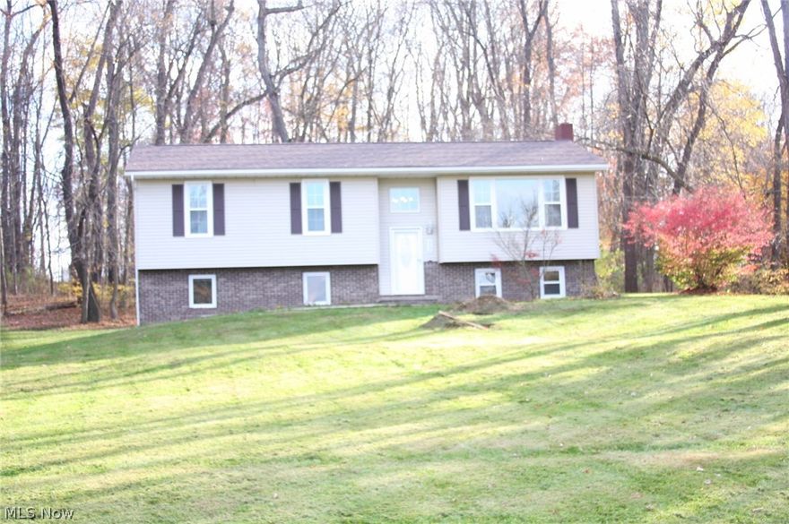 Don't wait to bring your buyers to this beautiful, newly renovated home that needs nothing; ready to move in!
Four bedrooms and two baths; 3/1 upstairs and 1/1 down.

It features 1.3 acres with a small area of woods in the back yard....a nice country-like setting but
still close enough to Manchester Road near the Stark/Summit county line.....the street has no outlet
so the traffic is low. Very quiet neighborhood.

The house has a completely updated and tasteful look both inside and out. It features a brand new roof, new thermal grid windows, new siding, new plumbing, all new gorgeous kitchen that is open to the dining room area. The kitchen has beautiful, quality-made cabernet cabinets, new sink and fixtures, stainless dishwasher, built-in microwave, and new counters. The home also has new six-panel interior doors, new lighting, and new wood trim.

Both bathrooms are completely new with tub,flooring, vanity, lighting, and tile floors throughout. All the carpeting is new and al