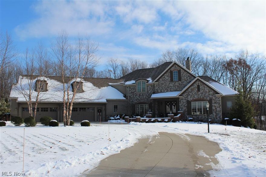 This Biltmore Estate home on 2.35 acres was custom built by Memmer Homes.  exceptional quality & detail are evident in this 5 bedroom, 5.5 bath home w/7,000+ sq. ft.  Walk up to the gorgeous double door front courtyard into a barreled ceiling foyer.  Once inside you will see how open the 1st floor is!  There is a 1st flr office with built in bookcases & first floor master suite w/private deck overlooking the fabulous backyard.  Soaring great room opens to an amazing kitchen.  Back hallway is an owners dream... walk-in pantry, desk, walk in closet & laundry room.  Upstairs there are 3 add'l bedrm suites.  The walkout lower level has a 5th bedrm, full bath, theater rm, family rm w/stone fireplace, workout rm & office.  The exterior living is a true paradise w/your own private walking trail, gazebo, water fall, bridge & picnic area.  The landscaping is lavish & absolutely beautiful.  Get ready to fall in love.  Extensive decking & patios makes this truly a great place to live & entertain.