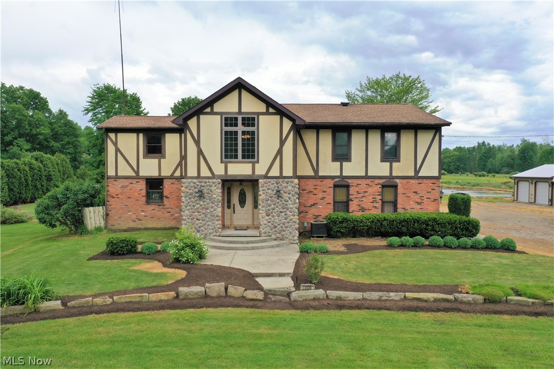 Take a look at the virtual tour link above! Another $40,000 price reduction for total of 90k! Sellers are ready! Visit this huge and spacious, English Tudor style home with 5 bedrooms and a 2nd floor laundry (or 6th bedroom) on 10 acres with a 7 car garage, pond and barn! With a mix of new and old, you will feel the charm of the original home, but enjoy the newer features of the additions built through the years! Every corner of this home has storage galor! This family used the largest room of the house as a dining room, however I picture a game room with a pool table in this space that looks out to the back of the property. The master bedroom has it's own full bath and it has a bonus octagon loft space (observatory) that created room for a 3 story Christmas tree every year! With a multitude of living spaces, this could be an entertainers dream home. Off the "rec" room, there is a screened in porch and also the back deck with is surrounded by beautiful landscaping, including a copper t
