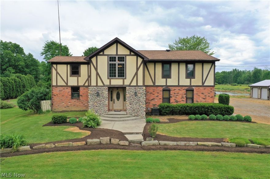 Take a look at the virtual tour link above! Another $40,000 price reduction for total of 90k! Sellers are ready! Visit this huge and spacious, English Tudor style home with 5 bedrooms and a 2nd floor laundry (or 6th bedroom) on 10 acres with a 7 car garage, pond and barn! With a mix of new and old, you will feel the charm of the original home, but enjoy the newer features of the additions built through the years! Every corner of this home has storage galor! This family used the largest room of the house as a dining room, however I picture a game room with a pool table in this space that looks out to the back of the property. The master bedroom has it's own full bath and it has a bonus octagon loft space (observatory) that created room for a 3 story Christmas tree every year! With a multitude of living spaces, this could be an entertainers dream home. Off the "rec" room, there is a screened in porch and also the back deck with is surrounded by beautiful landscaping, including a copper t