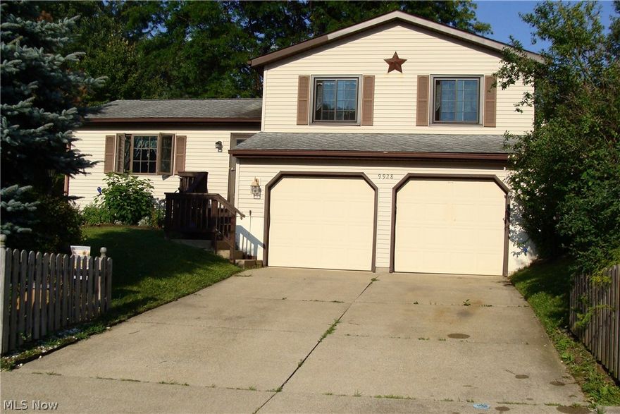 This Bi Level Home sits on a corner lot in Streetsboro. This home has 1604 Sq. Ft.  Upstairs there are 3 freshly painted Bedrooms with ceiling fans and 1 Bath. The main floor has a large Living room that has a gas fireplace and a dining area. The main floor also has a sliding door to the deck in the back of the home that is surrounded by a 4 ft high privacy fence that would be great for kids or pets.Then for the lower level there is a full bath and a kitchen that is larger than usually found in Bi Level homes and it is just steps away from the garage for easy unloading of groceries. There is a finished basement area that includes a built in bar, also in the basement is the laundry area.. The homes also features a 2 car garage that has insulated garage door with a opener. Through the sliding doors in the living room there is a 30x17 wood deck with built in seating and a 12x11 stone patio. The deck has a prep area and / or serving area for all the cookouts that you can have. The back yar