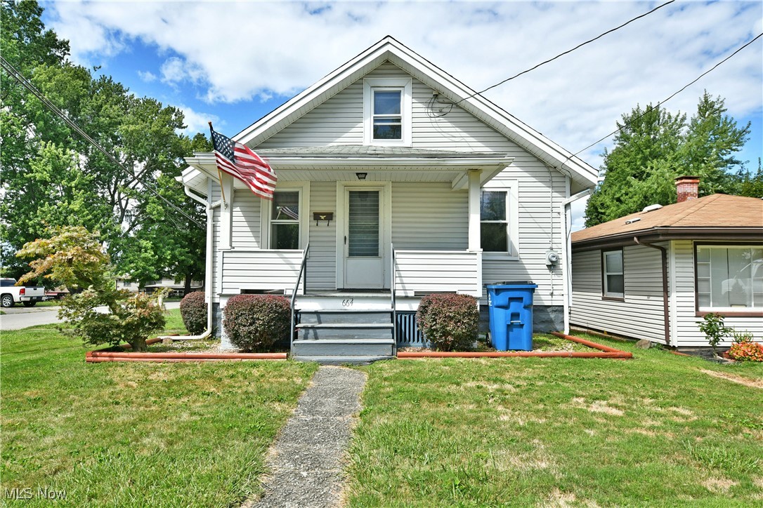 Colorfully engaging and move-in-ready, this refreshing Campbell property is quick to catch your eye and faster to steal your heart! The expansive corner lot stretches down a quiet side street to enjoy easy access to the detached two-car garage. A large storage shed awaits nearby for additional equipment needs. The charming home is outlined in manicured landscaping as the covered front porch creates an instant focal point. Step inside to find a cozy family room with whitewashed hardwood flooring and tall windows. A hidden staircase rises to reveal a pair of second floor loft bedrooms. Meanwhile, the central kitchen revels in its bold colorways and available eat-in dining space. Tiled flooring adds a tasteful pattern underfoot. Two impressively sized bedrooms each flank a tastefully updated full bath to complete the first floor. Downstairs, storage areas transcend into both a laundry room and lower workshop. A half bath awaits next to partially finished family room to round things out. Call today to make this home yours