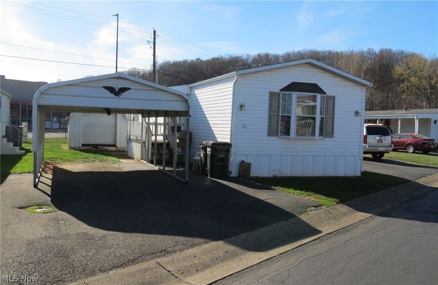 One owner single wide with 2 Bedrooms and 2 full baths.  Home has an open floorplan with fully applianced kitchen.  Master suite features walk-in closet, bath with double sinks, garden tub and shower.  Second bedroom located on opposite end of the home with walk-in closet and bay window. Hall bath has tub-shower combo.  Good sized laundry room located off kitchen (washer and dryer included).  Nice steps and deck at main entrance.  Home also has an outdoor water spigot, second entrance, and carport.  Storage shed with electric, workbench and garage door as access is also included with purchase.  Located in Minn-Lynn mobile home park and may stay upon preapproval of park manager.  Lot Rent $185/mo.  This one won't last long call today for a viewing.