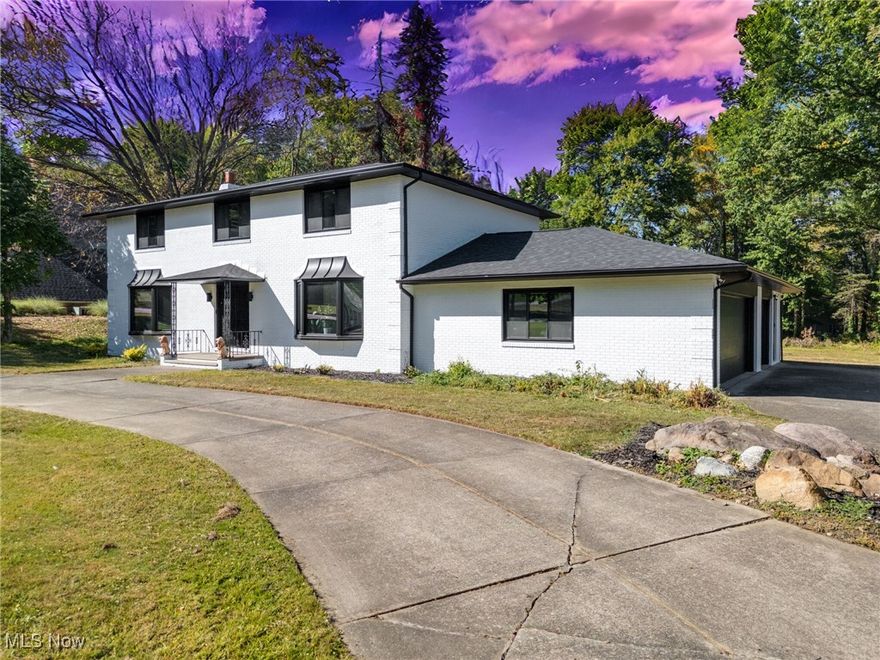 This stunning brick center-hall colonial combines timeless style with modern updates. Set on a private, tree-lined cul-de-sac lot with 120 feet of frontage and a circular driveway, this home offers four bedrooms, two full baths, and two half baths. Step through the double-door entry into the impressive two-story foyer and enjoy generously sized living, dining, and family rooms that make entertaining easy. The fully updated kitchen features granite countertops, an island, and a large pantry, with all appliances included. Freshly painted inside and out, the home also boasts a new roof and new A/C for peace of mind. Upstairs, you'll find three spacious bedrooms plus a large primary suite with dual walk-in closets and a private bath. The finished basement is designed for entertaining with a full bar, second kitchen area, and half bath, ideal for gatherings or extended-stay guests. Car enthusiasts will love the oversized attached garage with an 18-foot door, heat, hot and cold water, and utility sink, PLUS the additional detached garage/workshop with gas and electric service. Outside, enjoy a spacious backyard with a large deck, perfect for relaxing or hosting summer get-togethers.