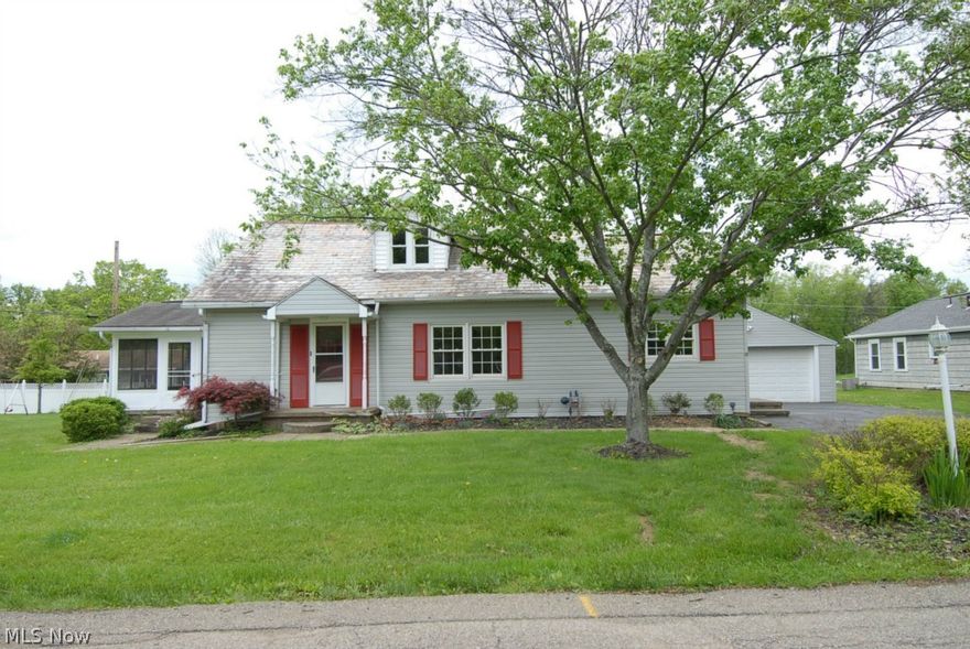 1 1/2 story home, level yard, detached 2 car garage.